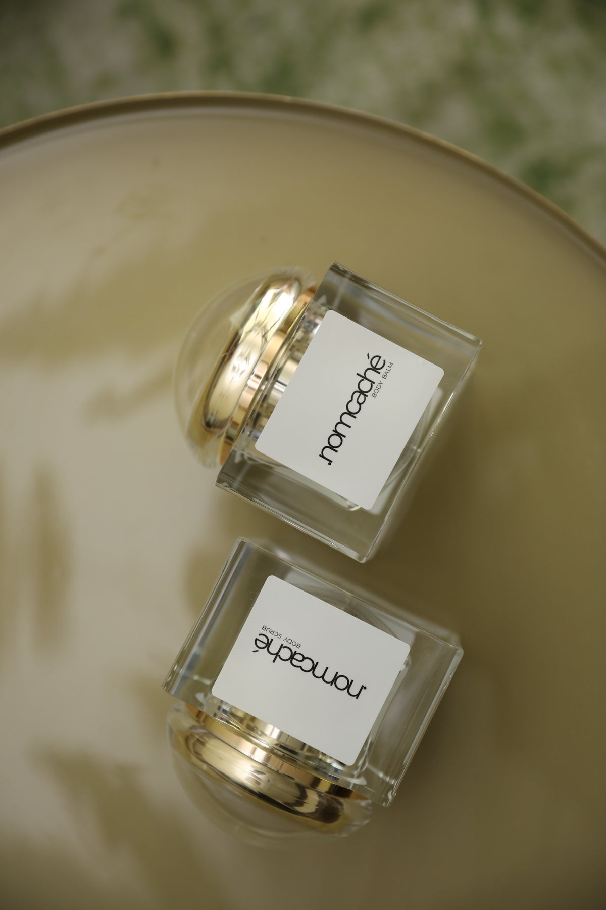 forma.nomcaché — top view of two skincare jars